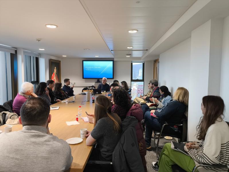 Photo of people listening to Alan Norrie